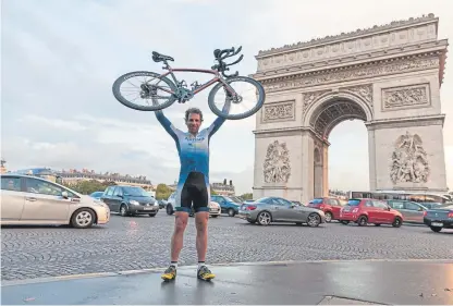  ??  ?? Mark Beaumont in front of the Arc De Triomphe in Paris after finishing his record-beating challenge to cycle around the world in 80 days.