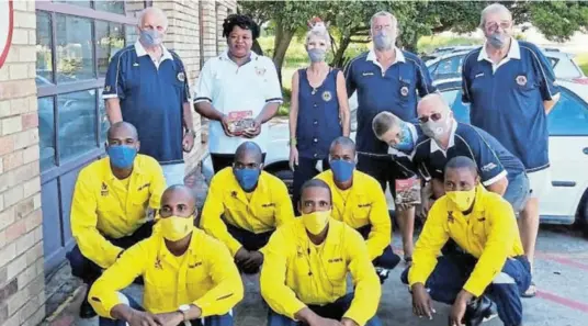 ??  ?? A TREAT FOR THE HELPERS: The Port Alfred Lions took time out on Christmas day to visit local emergency services personnel, including the police, security officers and others, and bought them some Lions Christmas cakes. Here the Lions are pictured with fire fighter trainees