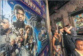  ?? Genaro Molina Los Angeles Times ?? “BLACK PANTHER,” here drawing fans at the El Capitan in Hollywood, is expected to take in an estimated $218 million over the long holiday weekend.