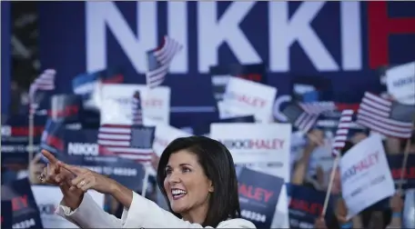  ?? WIN MCNAMEE — GETTY IMAGES ?? Republican presidenti­al candidate Nikki Haley points to supporters at her first campaign event Wednesday in Charleston, S.C. Former South Carolina Governor and United Nations ambassador Haley, officially announced her candidacy yesterday, making her the first Republican opponent to challenge former U.S. President Donald Trump.