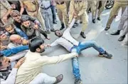  ??  ?? Policemen detain a protester in Srinagar on Monday. Shops, businesses and schools were shut while public transport was off the roads. Three CRPF personnel were also wounded when a suspected militant lobbed a grenade in south Kashmir’s
Anantnag...