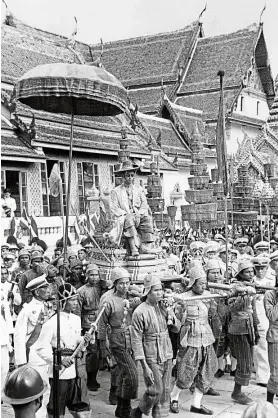  ?? — AFP ?? Newly crowned: Bhumibol being carried by a cortege during his coronation ceremony held on May 5, 1950, in Thailand.