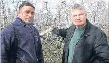  ?? Photo Helen Murdoch. ?? Conscienti­ous: RSE team leader Peni Fifita and orchardist David Easton.