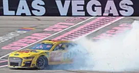  ?? Vegas. JOHN LOCHER/AP ?? Joey Logano does a burnout after winning a NASCAR race on Sunday in Las