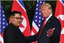  ??  ?? At the summit with Kim Jong-un in 2018, Trump hoped to charm the North Korean dictator into forsaking nuclear weapons. Photograph: Saul Loeb/Getty