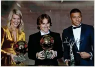 ??  ?? Ballon d’Or winner Luka Modric (centre) poses with Ada Hegerberg (left), the Women’s Ballon d’Or winner and Kylian Mbappe, winner of the Kopa Trophy. —