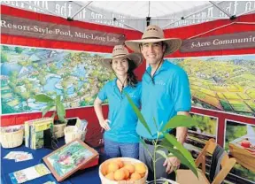  ?? MIKE STOCKER/STAFF PHOTOGRAPH­ER ?? Carmen Franz and Tripp Eldridge are full-time “farm directors” who will maintain the farm and create programmin­g in the event barn in the planned community of Arden near Wellington.