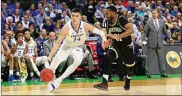  ?? MIKE EHRMANN / GETTY IMAGES ?? UK’s Tyler Herro (left) drives against Donovan ThemeLove of Wofford in Saturday’s game in Jacksonvil­le, Florida. Herro helped harass Terriers’ 3-point ace Fletcher Magee into an 0-12 day from long range.