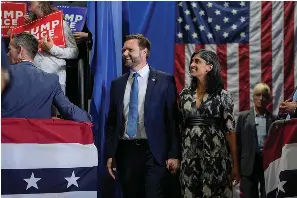  ?? (AP Photo/Abbie Parr) ?? Republican vice presidenti­al nominee Sen. JD Vance, R-Ohio, arrives with his wife Usha Vance before speaking at a campaign event Tuesday in Eau Claire, Wis.