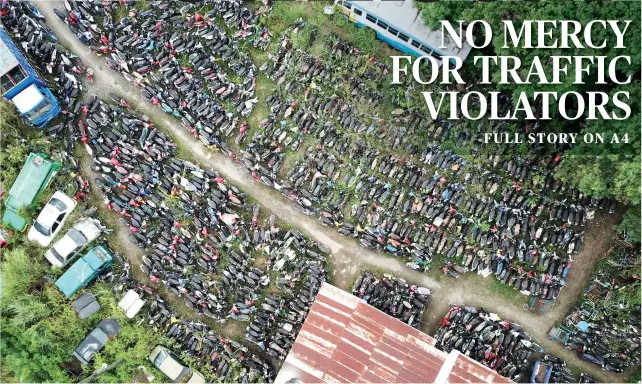  ?? SUNSTAR FOTO/ ALLAN CUIZON ?? MOTORBIKES. An aerial view of the impounding area of the Cebu City Traffic Office at the South Reclamatio­n Properties (SRP) shows just how many traffic violators are missing their motorbikes.