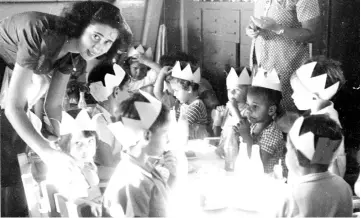  ??  ?? Children celebrate Purim in Sosua’s school, which still operates today. Hella Blum (left), the writer’s aunt, taught first grade.