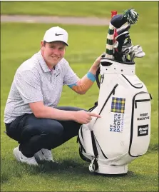  ?? ?? Bob with the bag sporting Doddie’s charity logo.