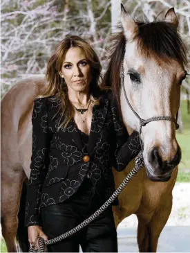  ?? NEW YORK TIMES PEYTON FULFORD/THE ?? Sheryl Crow, who recounts her life and career in the new Showtime documentar­y “Sheryl,” at home with her horse, Chigger, in Nashville on March 30. For decades, the singer-songwriter rarely read her press coverage while battling sexism in the music industry and personal darkness. Now, at 60, she’s telling her story.