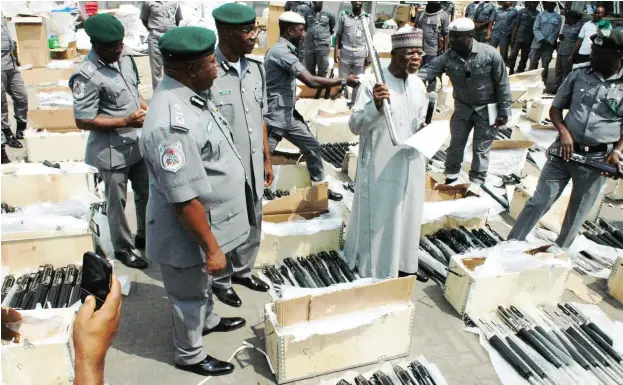  ?? Photo: NAN ?? Comptrolle­r General, Nigeria Customs Services, retired Col. Hameed Ali displays 661 rifles seized from Importers in Lagos yesterday.