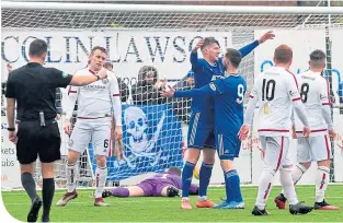  ??  ?? Cove’s Jamie Masson celebrates after scoring to make it 3-0