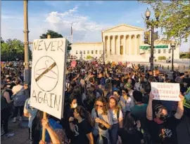  ?? Alex Brandon Associated Press ?? PROTESTERS rally outside the U.S. Supreme Court on May 3, a day after the publicatio­n of a draft opinion to overturn the landmark Roe vs. Wade decision.