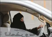  ?? HASAN JAMALI / AP ?? Aziza Yousef drives a car on a highway in Riyadh, Saudi Arabia, in 2014 as part of a campaign to defy Saudi Arabia’s ban on women driving.