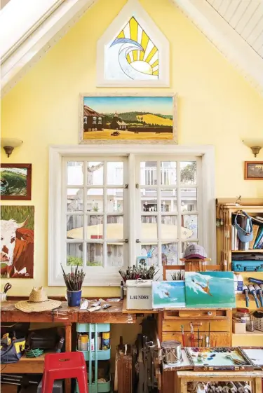  ??  ?? CREATING SPACES. Natural light is essential for an artist, and the mullioned windows in Steve’s studio provide it in abundance. The space is densely organized with evidence of creativity hard at work. He paints his masterpiec­es here, inspired by the...