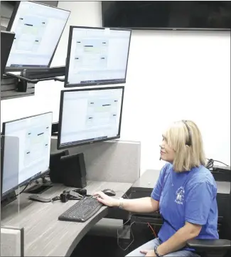  ?? Brodie Johnson • Times-Herald ?? The new St. Francis County 911 dispatch and call center, located inside the new SFC Detention Center, went live today as dispatcher­s began working at their new stations. Dispatcher Natalie Spain gets familiar with a station this morning as final work was being done on the system. Starting today, all of the emergency calls in the county will go through this system.