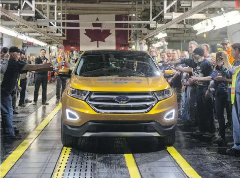  ?? CHRIS YOUNG/THE CANADIAN PRESS ?? Ford celebrates the global production start of the 2015 Ford Edge at its plant in Oakville, Ont., in 2015. U.S. trade czar Robert Lighthizer is insisting on major changes for NAFTA, such as on rules of origin for autos and auto parts to require...