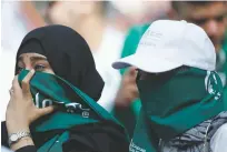  ?? HASSAN AMMAR/ASSOCIATED PRESS ?? Saudi women are seen ahead of the Group A match between Russia and Saudi Arabia on Thursday at the Luzhniki stadium in Moscow.