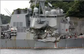  ?? AP PHOTO/EUGENE HOSHIKO ?? In this Sunday photo, damaged USS Fitzgerald is docked at the U.S. Naval base in Yokosuka, southwest of Tokyo after colliding with Philippine-flagged container ship ACX Crystal off Japan on Saturday.