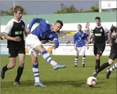  ??  ?? Ashford’s Danny Byrne pulls the trigger during the Wicklow Cup final.