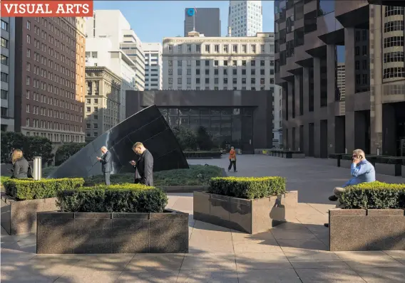  ?? Photos by Daniel Postaer ?? “San Francisco, California Street, 2015,” with five people on cell phones in an empty plaza, is part of Daniel Postaer’s first gallery or museum showing.