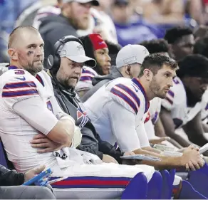  ?? JOHN MINCHILLO/THE ASSOCIATED PRESS ?? Buffalo’s Derek Anderson ponders his fortunes late in the Bills’ 37-5 loss to the Indianapol­is Colts on Sunday. The recently signed quarterbac­k tossed three picks in the game.