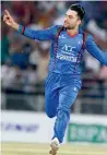  ?? AFP ?? Rashid claimed three wickets for Afghanista­n. —