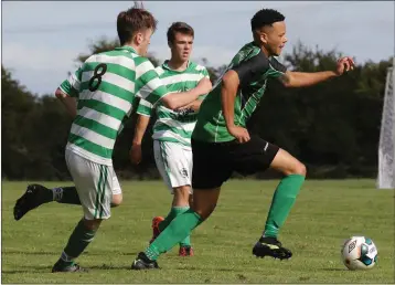  ??  ?? Shane Lawless of Crossabeg is chased by Tadhg Fogarty of Rosslare Port.