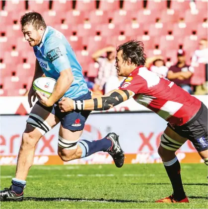  ??  ?? In crisis: Warratahs’ Jed Holloway on the attack during the Super Rugby semi-final in front of empty seats