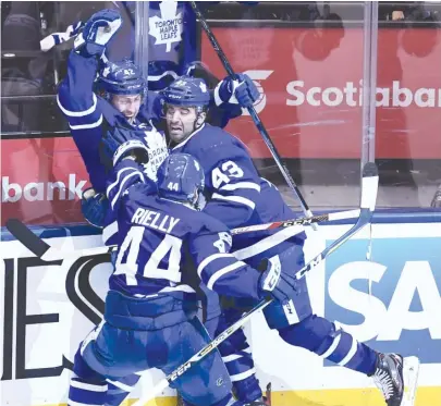  ?? | AP ?? The Maple Leafs’ Tyler Bozak ( top left) celebrates his overtime goal Monday against the Capitals in Toronto.