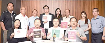  ??  ?? Seated from left, Syron, Chan, Phoong, Liaw and others at the press conference.