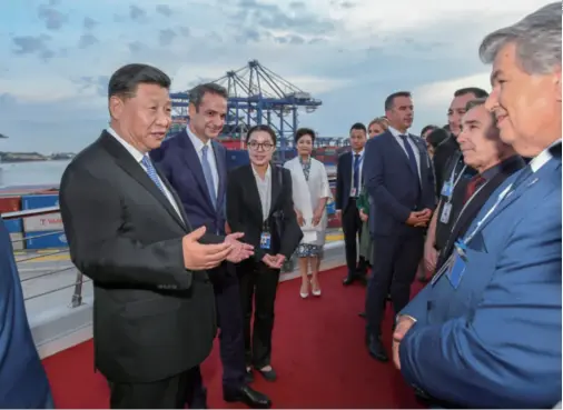  ??  ?? Chinese President Xi Jinping talks with representa­tives of local staff during a visit to the Port of Piraeus in Greece on November 11. The port, operated by China Ocean Shipping Co., is regarded as a flagship project of cooperatio­n within the framework of the Belt and Road Initiative