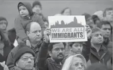  ?? REUTERS ?? People listen during a vigil in honour of Indian immigrant Srinivas Kuchibhotl­a,who was recently shot and killed in Kansas.