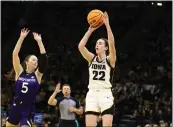  ?? MATTHEW HOLST — GETTY IMAGES ?? Iowa's Caitlin Clark had her 65th career double-double with 27points and 10assists against Holy Cross on Saturday.