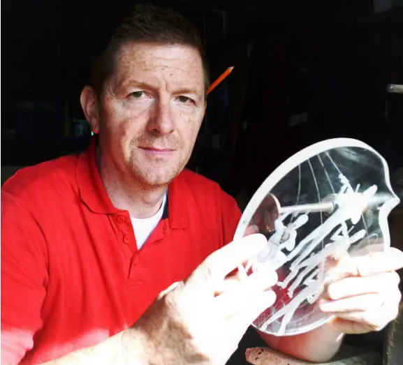  ??  ?? Master engraver Greg Sullivan has worked hard to carve himself a career after honing his skills at Waterford Crystal for 24 years