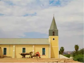  ??  ?? BELOW The Roman Catholic Mission Church (c.1927) towers over the remote farming town.