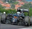  ??  ?? Battling: Alonso was seventh in Hungary