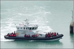  ?? (AP/PA/Gareth Fuller) ?? A group of people thought to be migrants are brought in to Dover, Kent, onboard a Border Force vessel, following a small boat incident Monday in the English Channel.