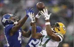  ?? ADAM HUNGER ?? New York Giants’ Antoine Bethea, left breaks up a pass intended for Green Bay Packers’ Davante Adams during the first half of an NFL football game, Sunday, Dec. 1, 2019, in East Rutherford, N.J.