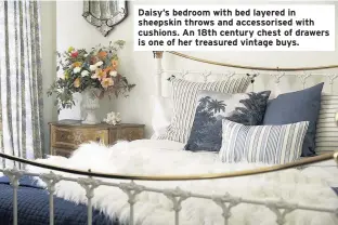  ??  ?? Daisy’s bedroom with bed layered in sheepskin throws and accessoris­ed with cushions. An 18th century chest of drawers is one of her treasured vintage buys.