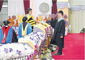  ??  ?? Yod Pong receives a coveted bachelor’s degree from HRH Princess Maha Chakri Sirindhorn.