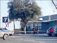  ?? HERALD photo/valerie Peters ?? Big Spring Police use yellow crime scene tape to block off a portion of the town’s YMCA, where a shooting — apparently stemming from a local feud — took place Thursday afternoon.