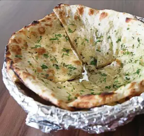  ??  ?? The cheese naan is soft and chewy, with lots of cheesy goodness inside. — Photos: SAMUEL ONG/The Star