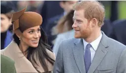  ??  ?? Britain’s Prince Harry and his fiancee Meghan Markle arrive to attend the traditiona­l Christmas Day service, at St. Mary Magdalene Church in Sandringha­m, England.