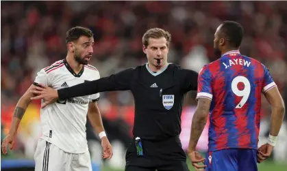  ?? Lateness. Photograph: Martin Keep/AFP/Getty Images ?? Bruno Fernandes, pictured arguing with Jordan Ayew during Manchester United’s pre-season win, says players must be punished for