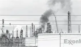  ?? Melissa Phillip / Staff photograph­er ?? Smoke billows from Exxon’s Baytown facility, where a fire was reported last weekend. That and a similar fire in Los Angeles could raise gasoline prices.