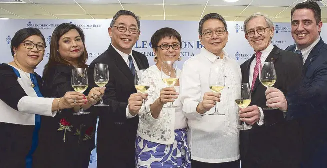  ??  ?? Ateneo de Manila University president Jose Ramon T. Villarin, S.J. (third from right) with (from left) Ateneo Center for Continuing Education executive director Marleth S. Calanog; Le Cordon Bleu Ateneo de Manila Institute (LCBAI) director Liza H. Morales; Ateneo Graduate School of Business dean Rodolfo P. Ang; Ateneo Profession­al Schools vice president Antonette Palma-Angeles and Le Cordon Bleu president and chief executive officer André J. Cointreau;